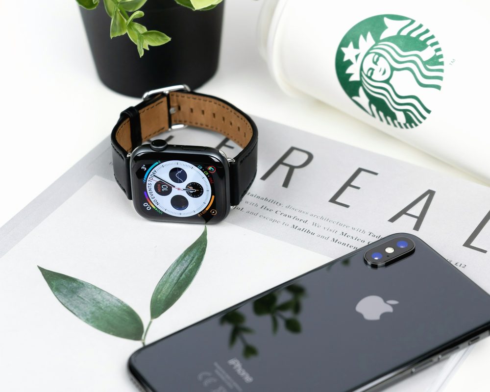 Phone and watch on a table, send your flash